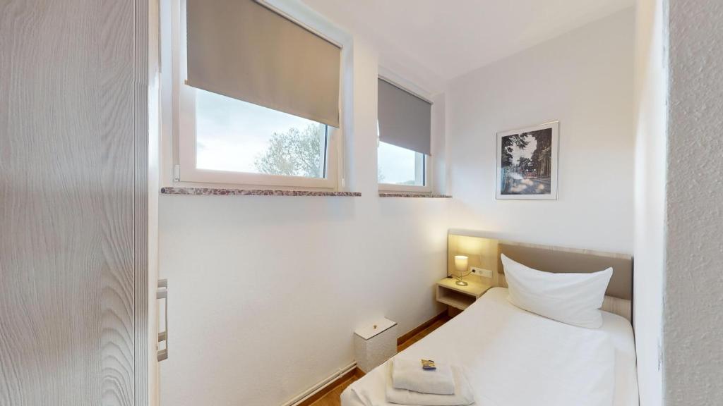 Postel nebo postele na pokoji v ubytování Hotel am Stadtpark Nordhausen