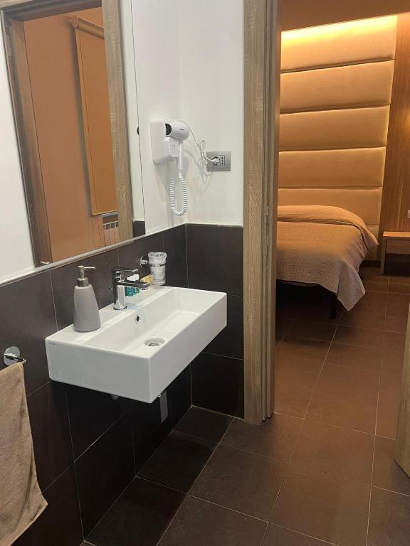 Postel nebo postele na pokoji v ubytování Hotel Ristorante Borgo Antico