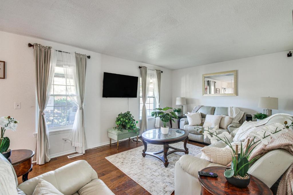 a living room with a couch and a table at 3 Mi to Diamond Ballroom Home with Fenced Yard! in Oklahoma City