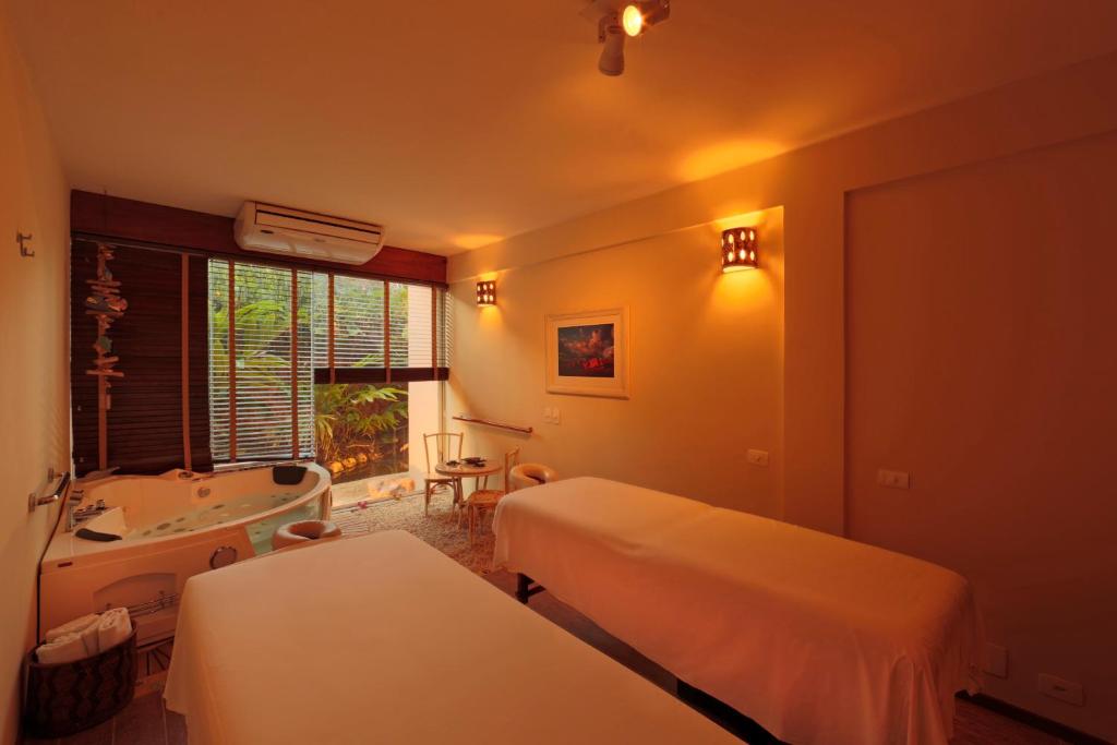 Cama ou camas em um quarto em Manary Praia Hotel