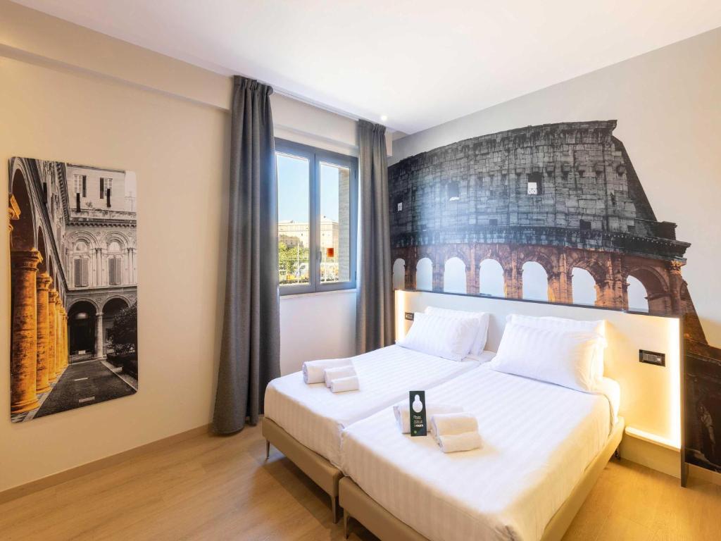 Postel nebo postele na pokoji v ubytování B&B Hotel Roma Tuscolana San Giovanni