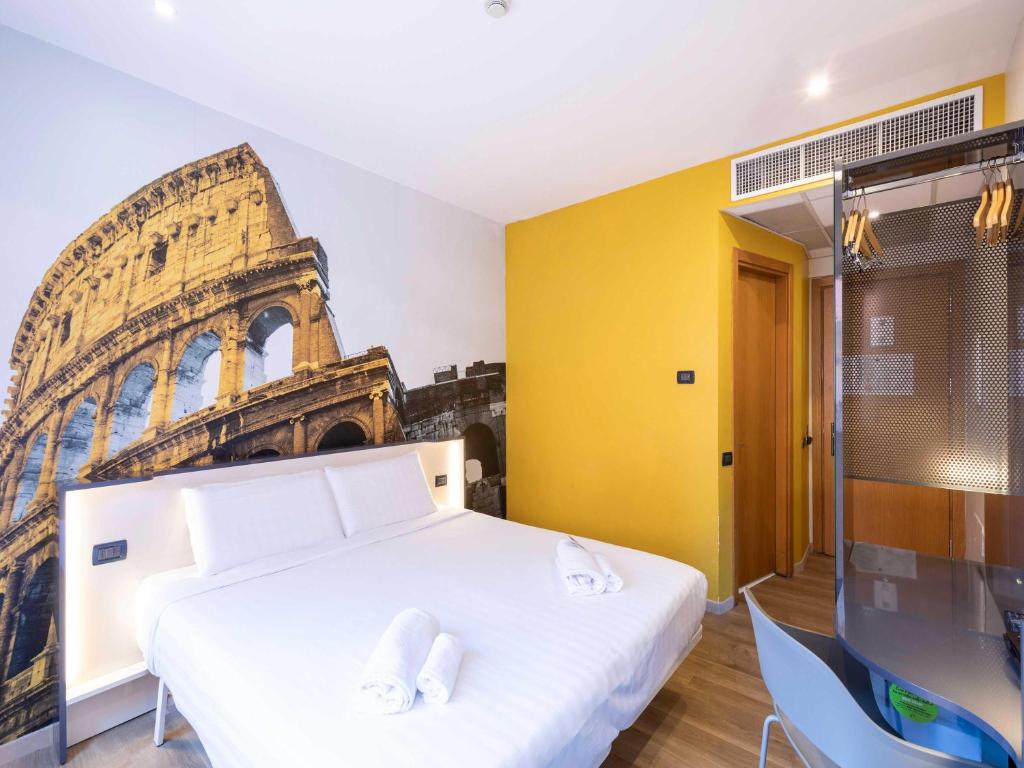 Postel nebo postele na pokoji v ubytování B&B Hotel Roma Tuscolana San Giovanni