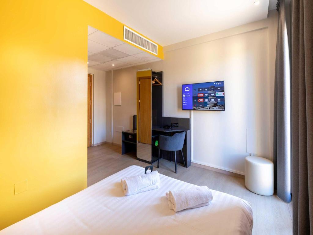 Postel nebo postele na pokoji v ubytování B&B Hotel Roma Tuscolana San Giovanni