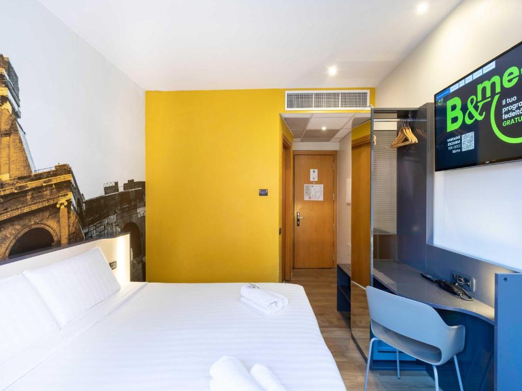Postel nebo postele na pokoji v ubytování B&B Hotel Roma Tuscolana San Giovanni