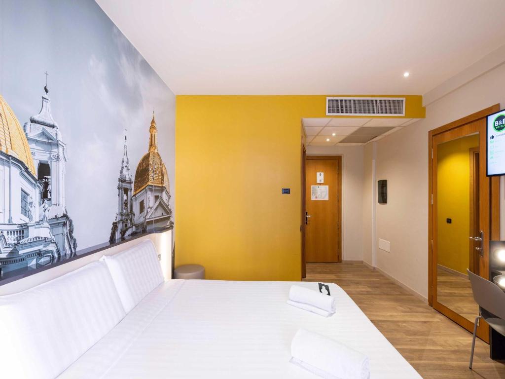 Postel nebo postele na pokoji v ubytování B&B Hotel Roma Tuscolana San Giovanni