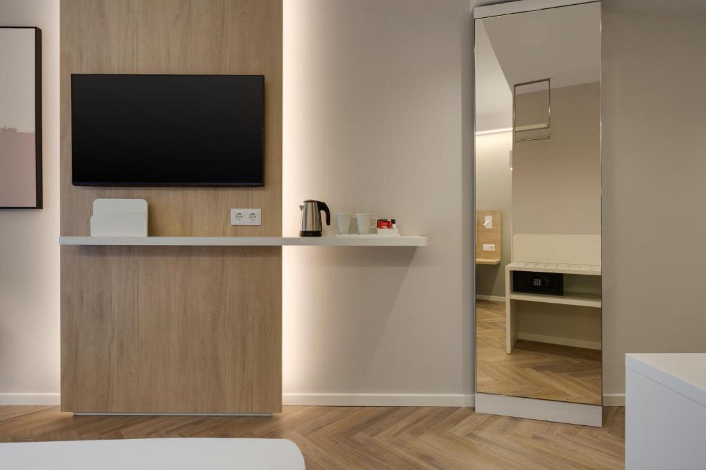 TV a/nebo společenská místnost v ubytování Holiday Inn Express Évora by IHG