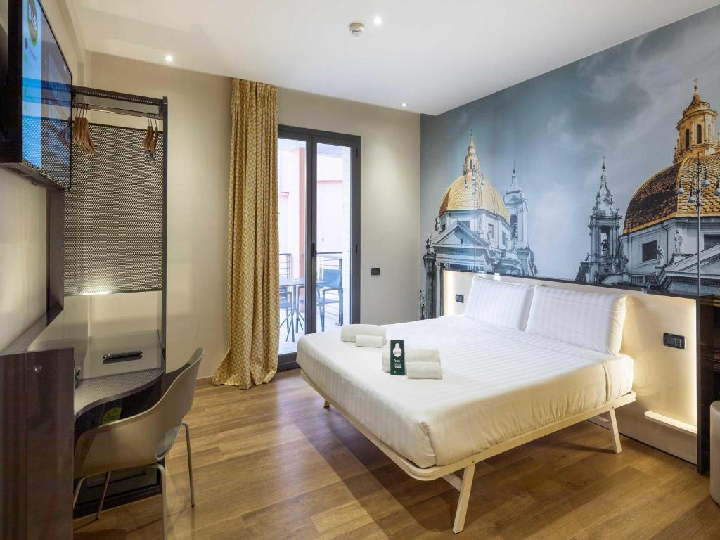 Postel nebo postele na pokoji v ubytování B&B Hotel Roma Tuscolana San Giovanni