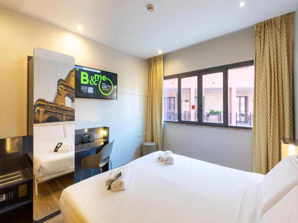 Postel nebo postele na pokoji v ubytování B&B Hotel Roma Tuscolana San Giovanni