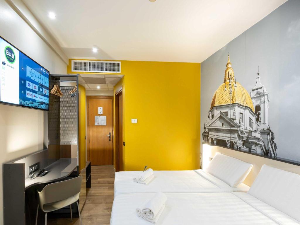 Postel nebo postele na pokoji v ubytování B&B Hotel Roma Tuscolana San Giovanni