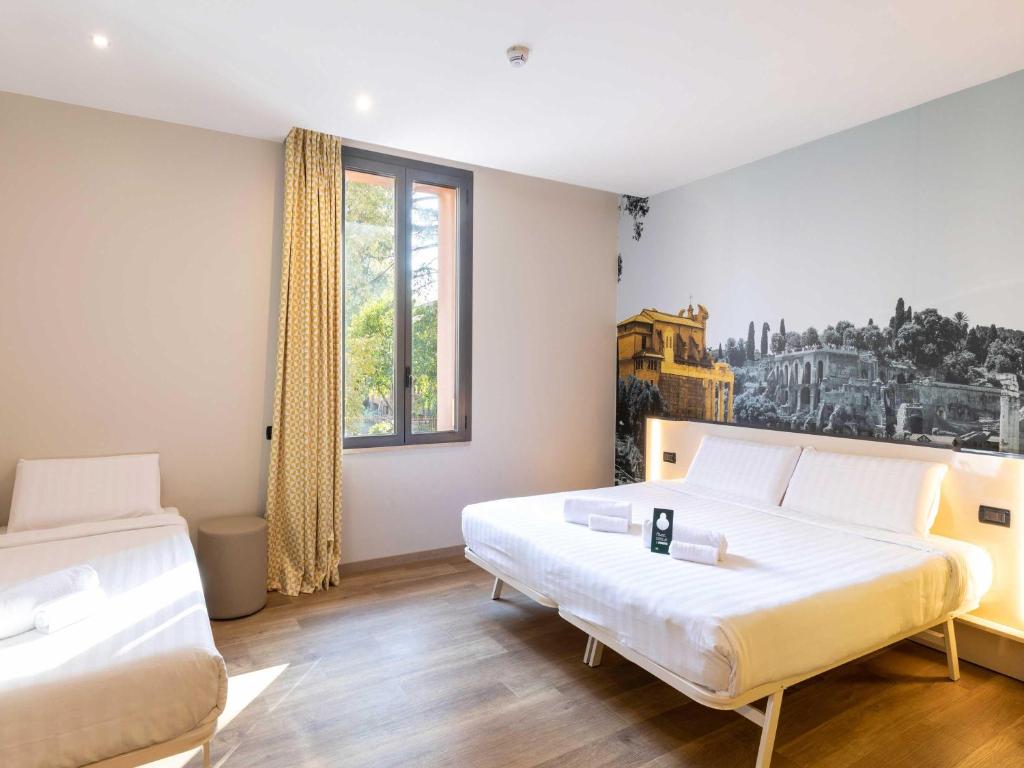 Postel nebo postele na pokoji v ubytování B&B Hotel Roma Tuscolana San Giovanni