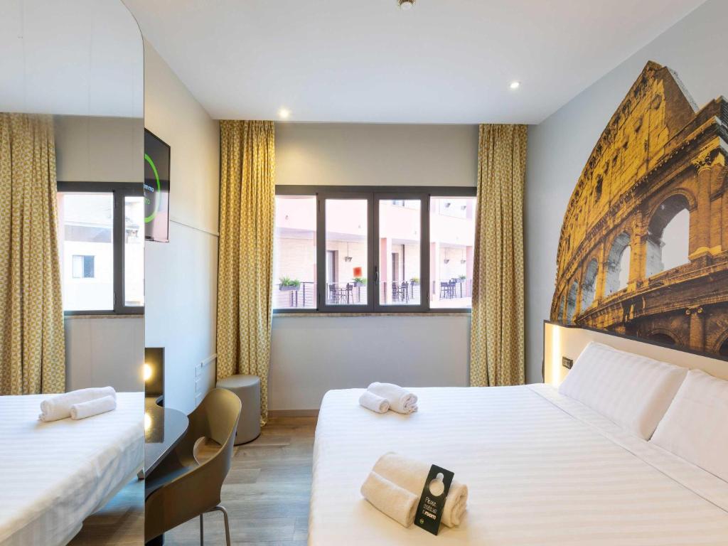 Postel nebo postele na pokoji v ubytování B&B Hotel Roma Tuscolana San Giovanni
