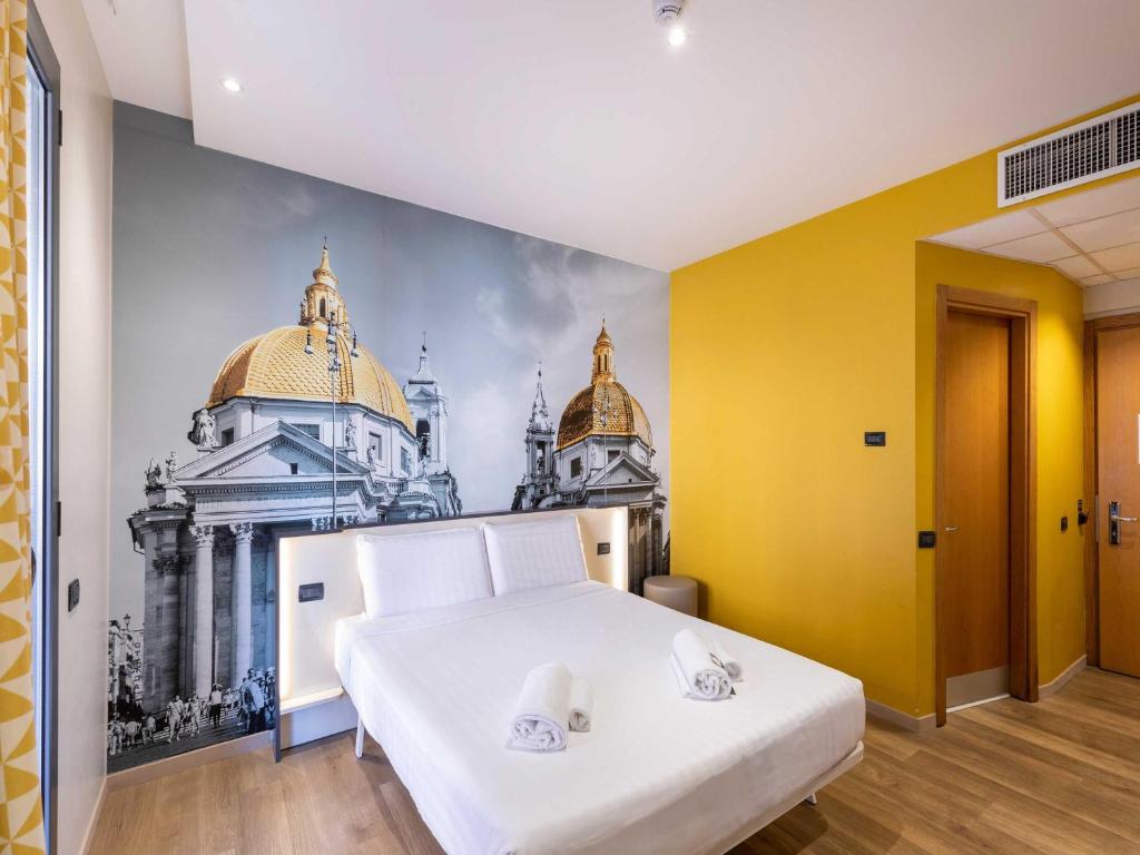 Postel nebo postele na pokoji v ubytování B&B Hotel Roma Tuscolana San Giovanni