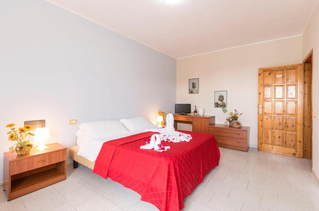 Postel nebo postele na pokoji v ubytování Hotel Calabrisella