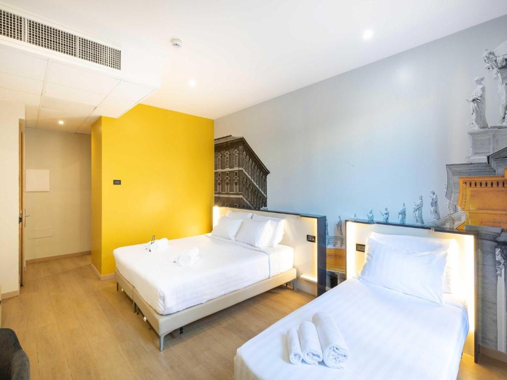 Postel nebo postele na pokoji v ubytování B&B Hotel Roma Tuscolana San Giovanni