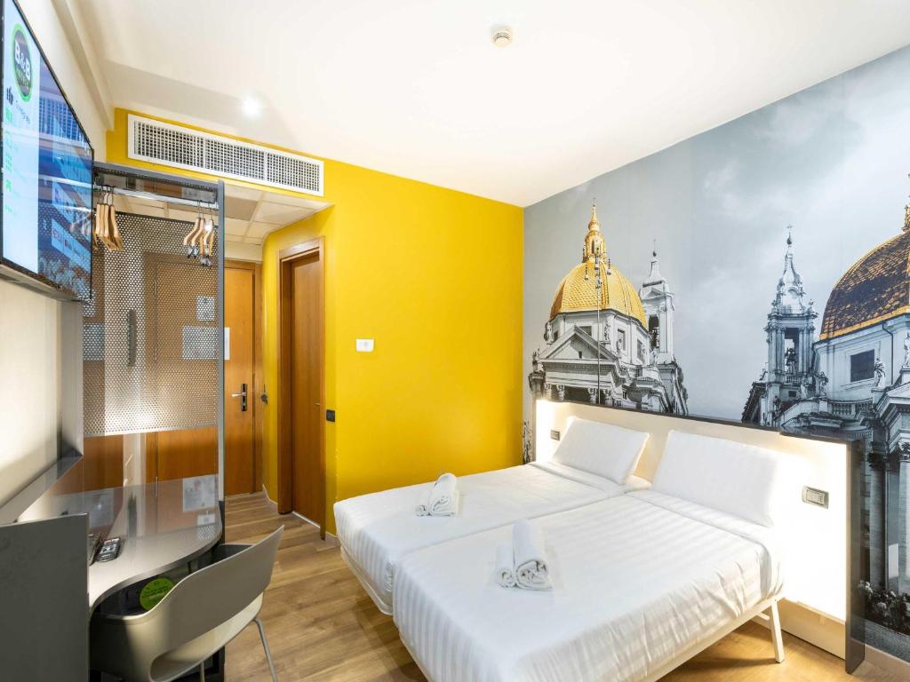 Postel nebo postele na pokoji v ubytování B&B Hotel Roma Tuscolana San Giovanni