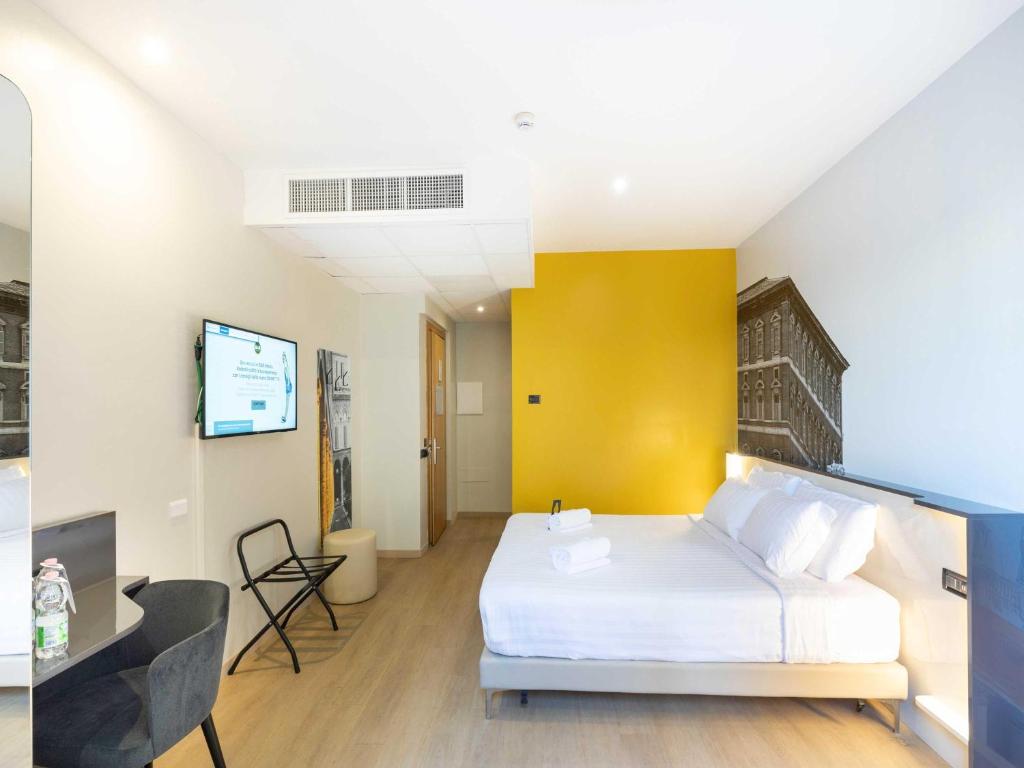 Postel nebo postele na pokoji v ubytování B&B Hotel Roma Tuscolana San Giovanni