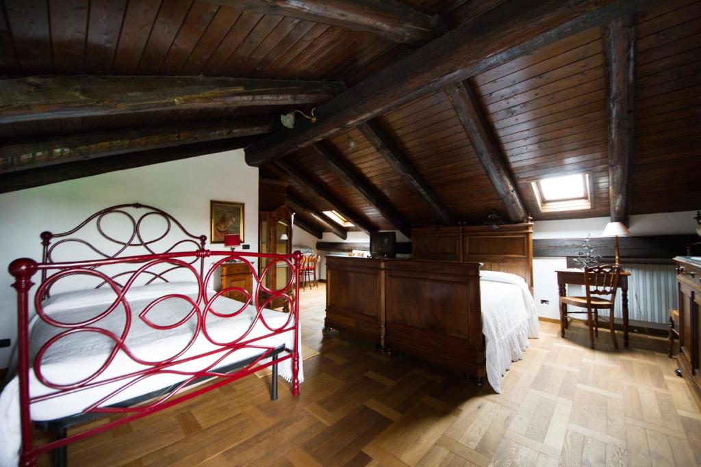 Postel nebo postele na pokoji v ubytování Agriturismo La Ca 'd Majin