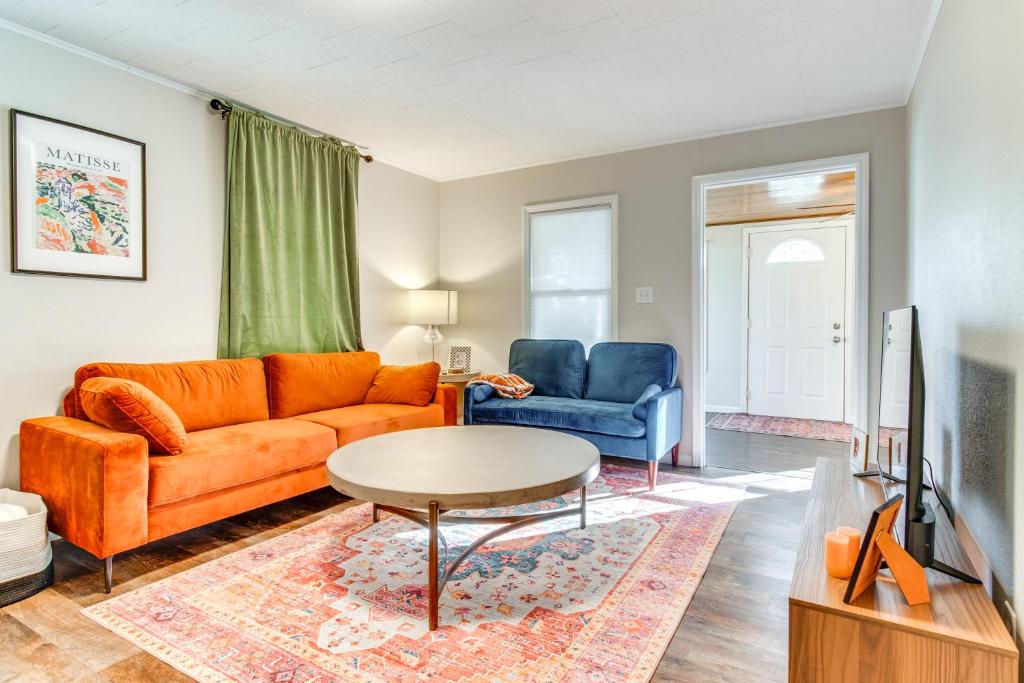a living room with a couch and a table at Hike, Boat and Fish Dog-Friendly Robinson Home in Robinson