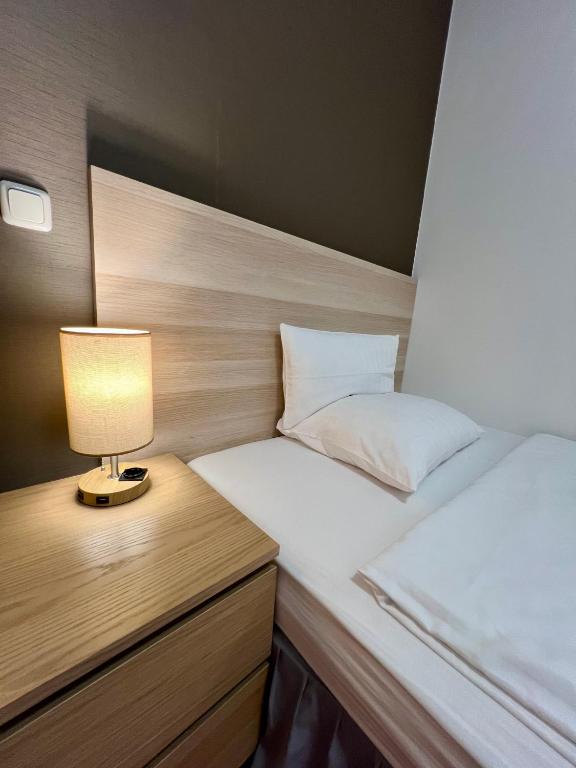 Postel nebo postele na pokoji v ubytování Hotel Residenz Stockstadt