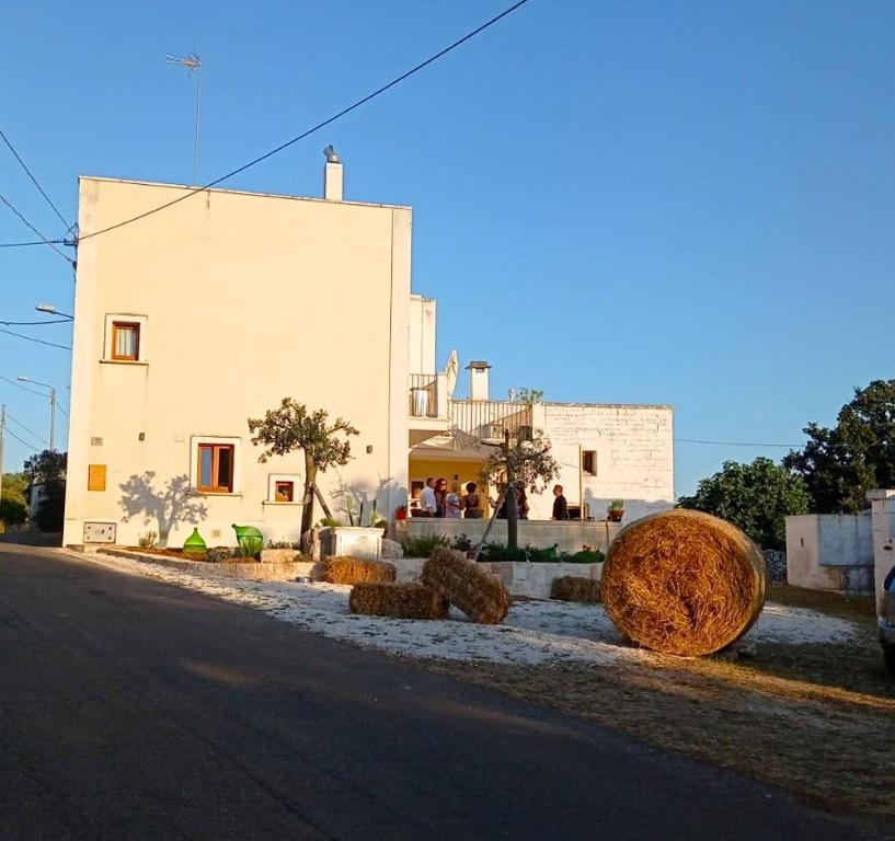 a building with hay bales on the side of a street at Massì bnb in Locorotondo