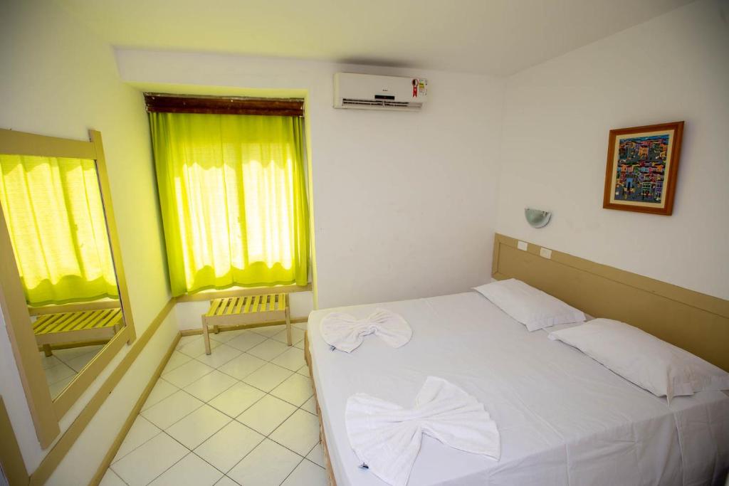 Postel nebo postele na pokoji v ubytování Rede Andrade Mar Hotel - Rio Vermelho