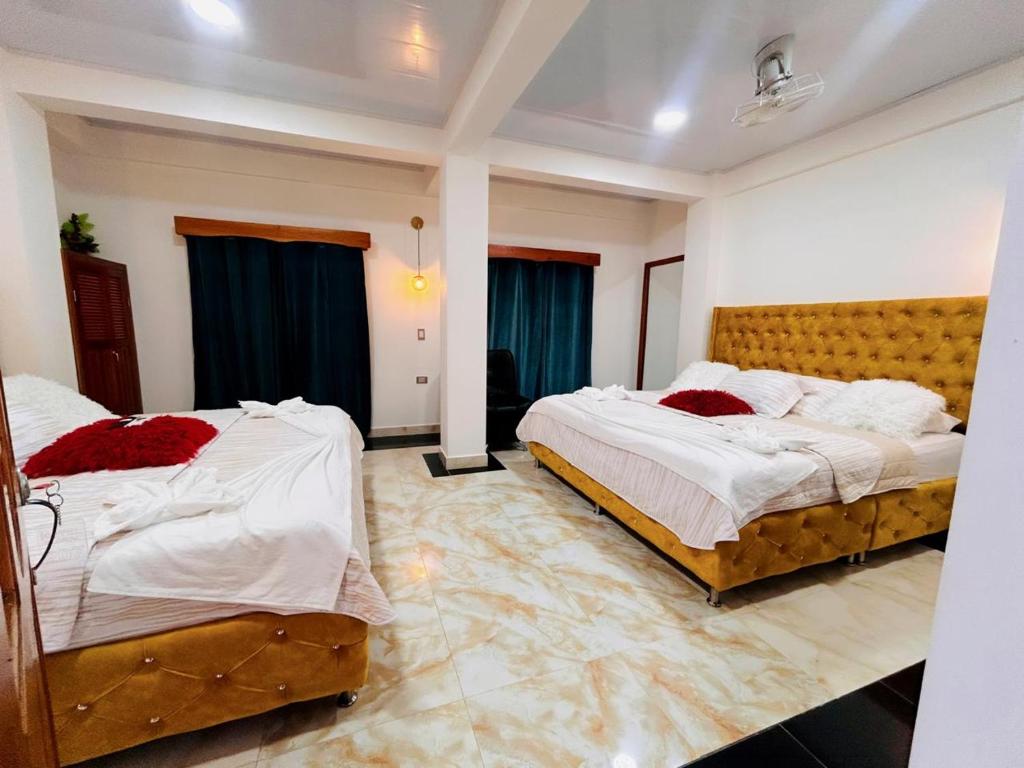 Postel nebo postele na pokoji v ubytování Hotel Glorial