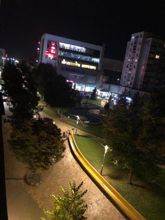 a view of a park at night in a city at Centru in Piteşti