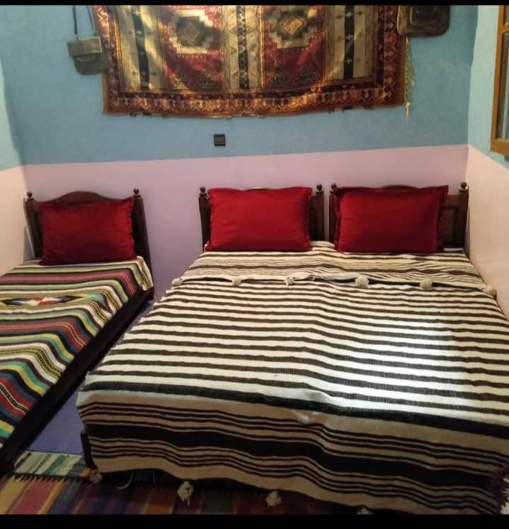 Postel nebo postele na pokoji v ubytování Gîte akioud mazik