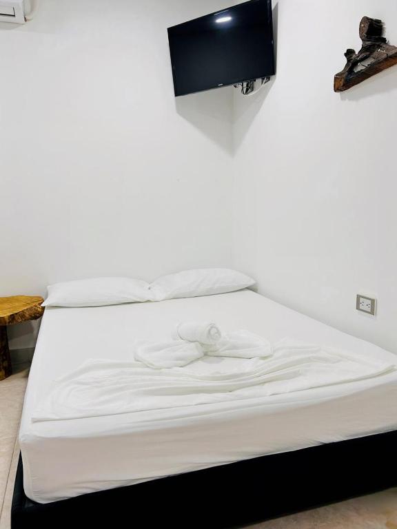 Postel nebo postele na pokoji v ubytování Hotel Glorial