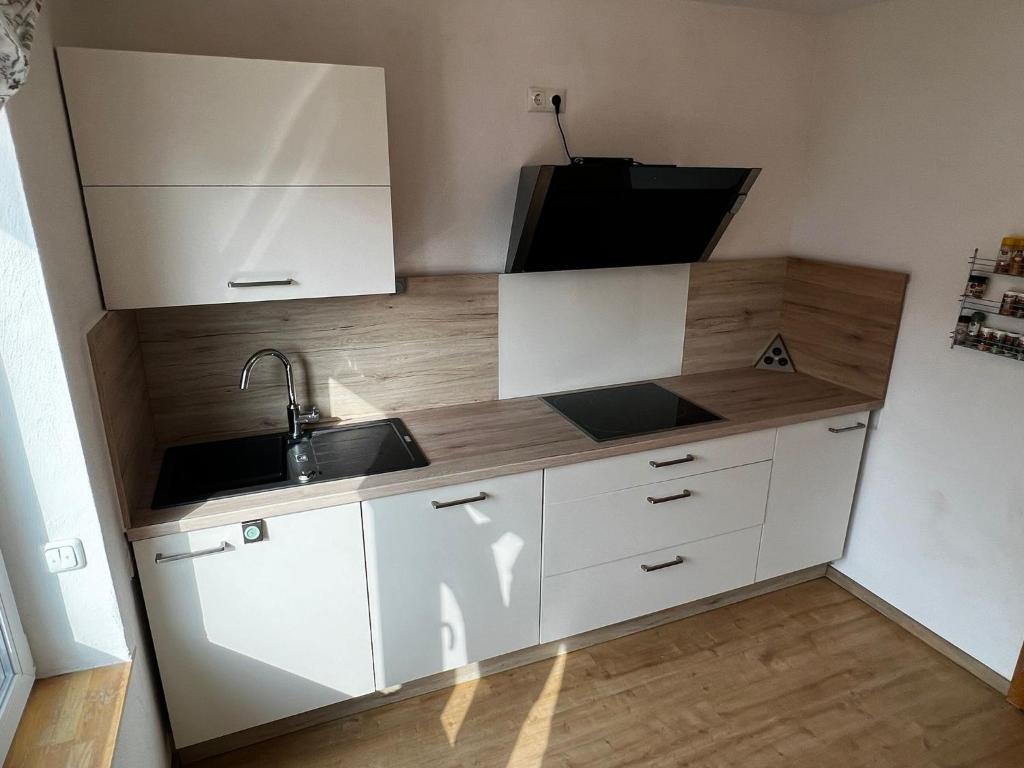 Kuchyň nebo kuchyňský kout v ubytování Hotel Wettlaufer