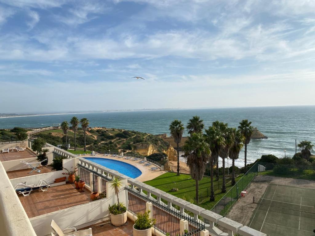 a view of the ocean from the balcony of a house at Silver Moon Beach House in Lagos