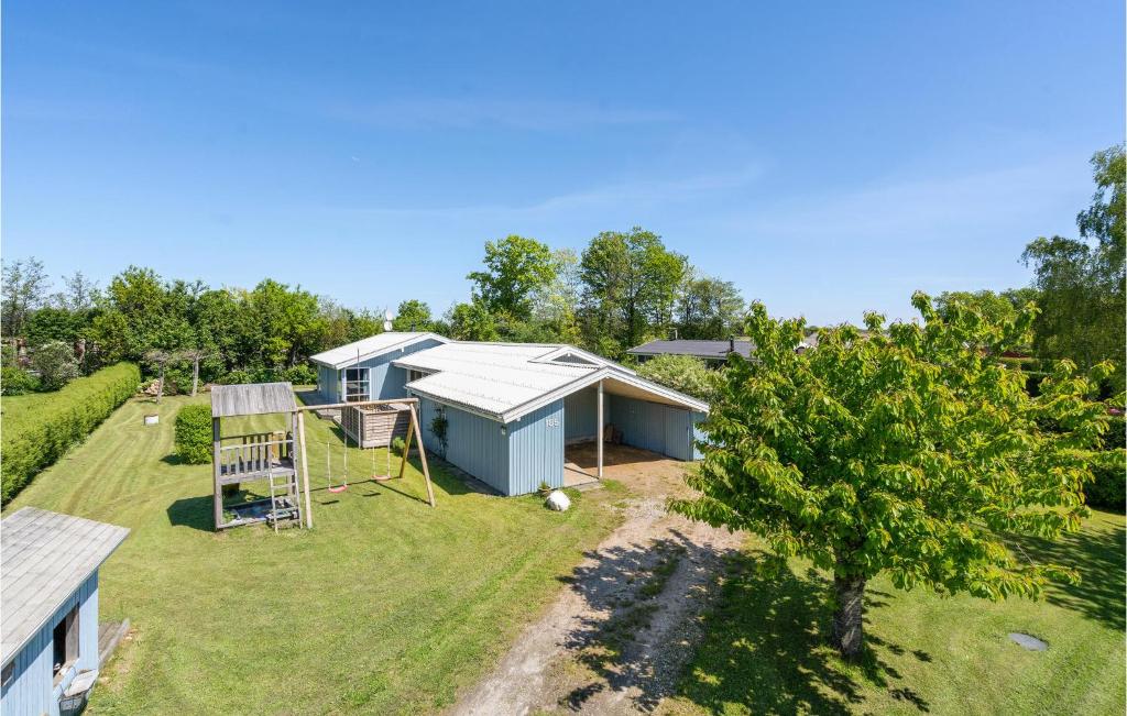 an aerial view of a house with a yard at Holiday Home Pøt Strandby Denm in Sønderby