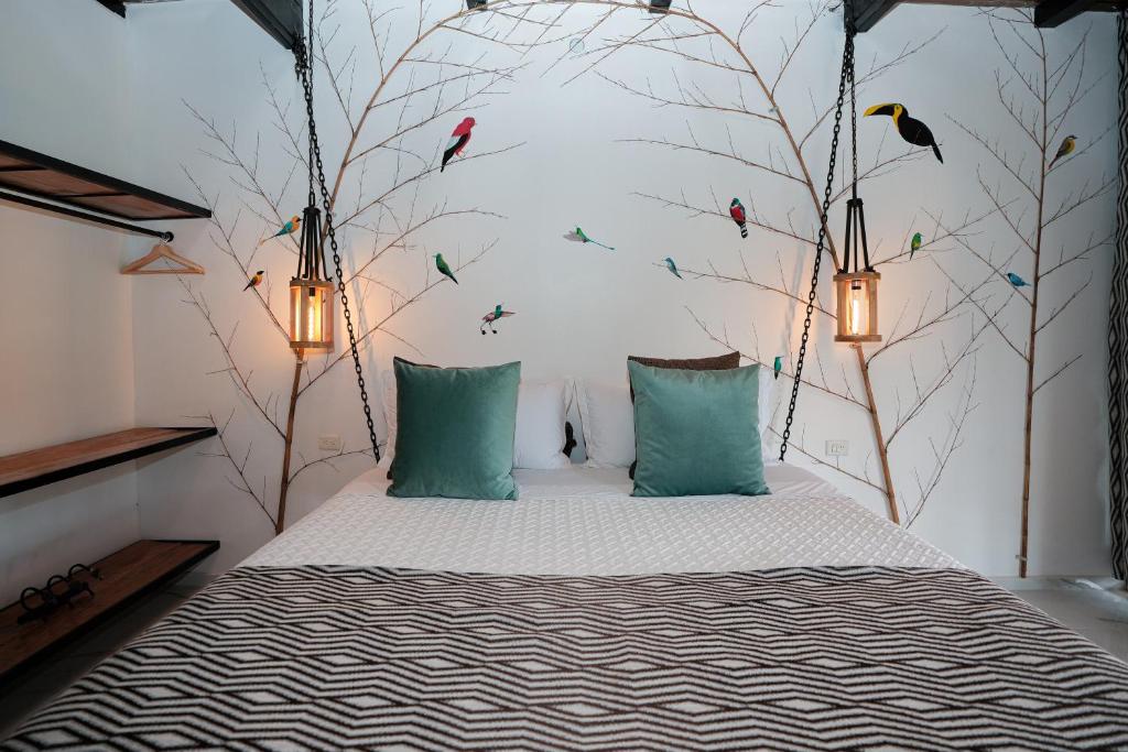 Postel nebo postele na pokoji v ubytování Suites Casa ColibrÍ