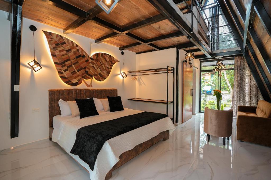 Postel nebo postele na pokoji v ubytování Suites Casa ColibrÍ
