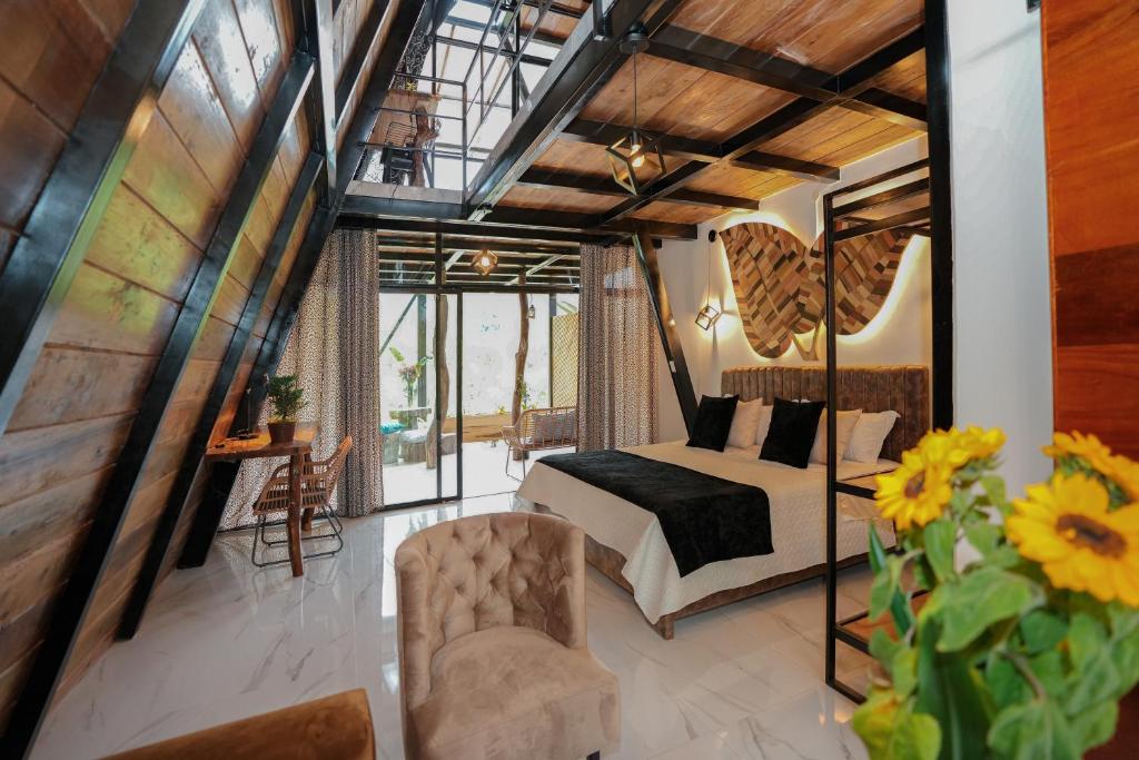 Postel nebo postele na pokoji v ubytování Suites Casa ColibrÍ