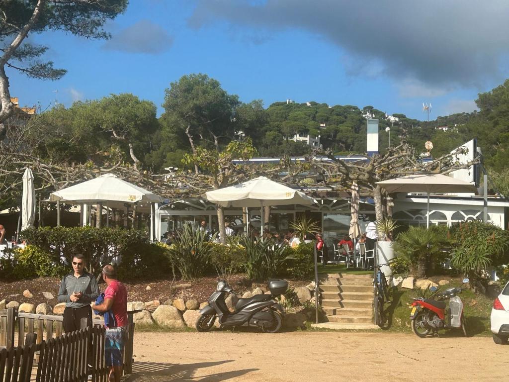 a group of people standing in front of a building at Canyelles BBQ Apartment in Lloret de Mar