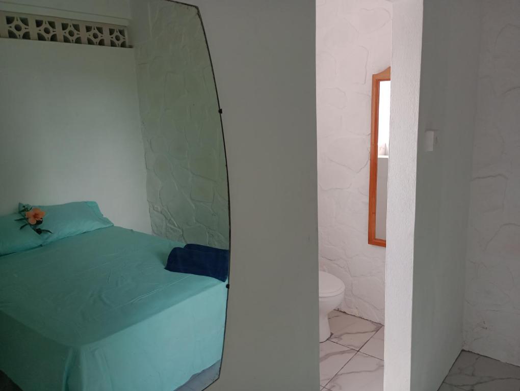 Postel nebo postele na pokoji v ubytování Garifuna Retreat Apartment