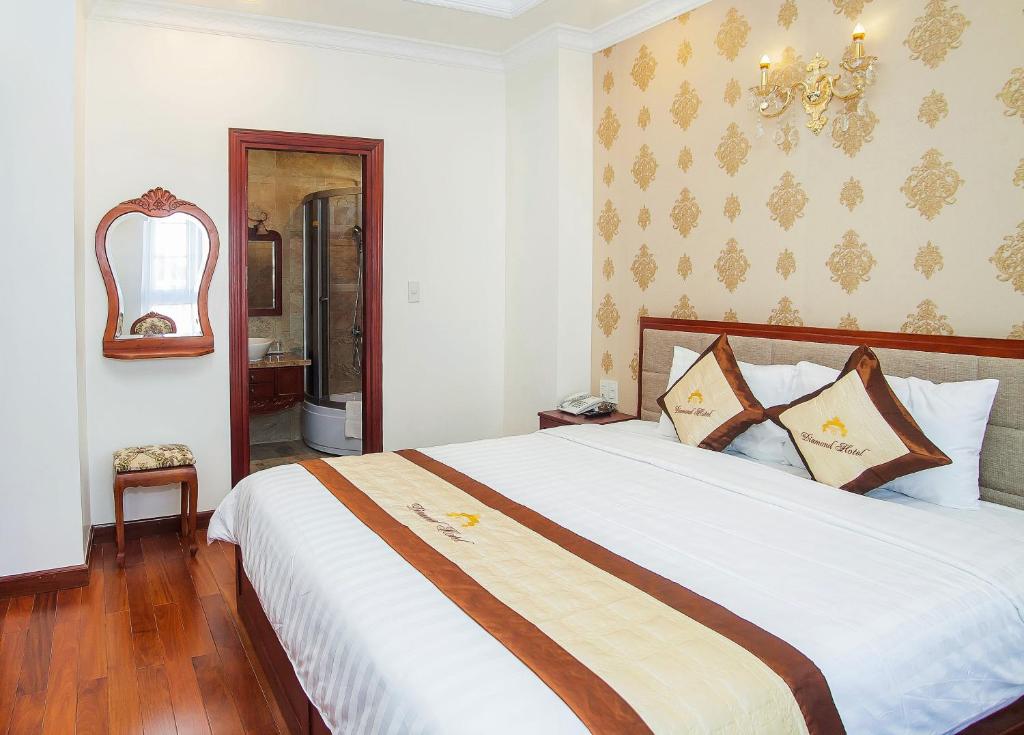 Postel nebo postele na pokoji v ubytování Diamond Hotel