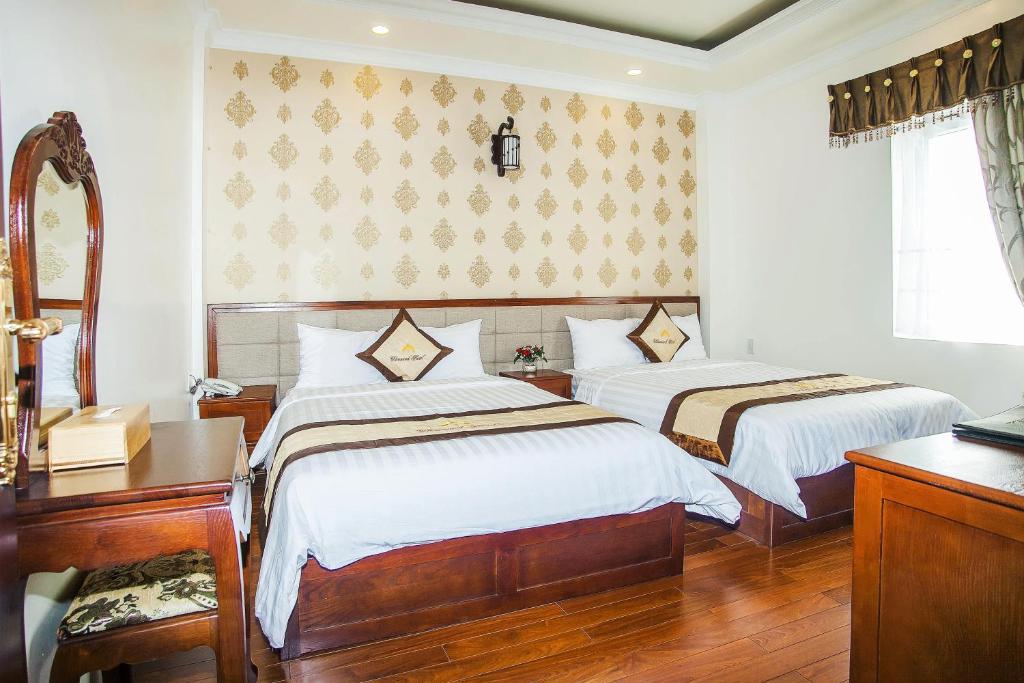 Postel nebo postele na pokoji v ubytování Diamond Hotel