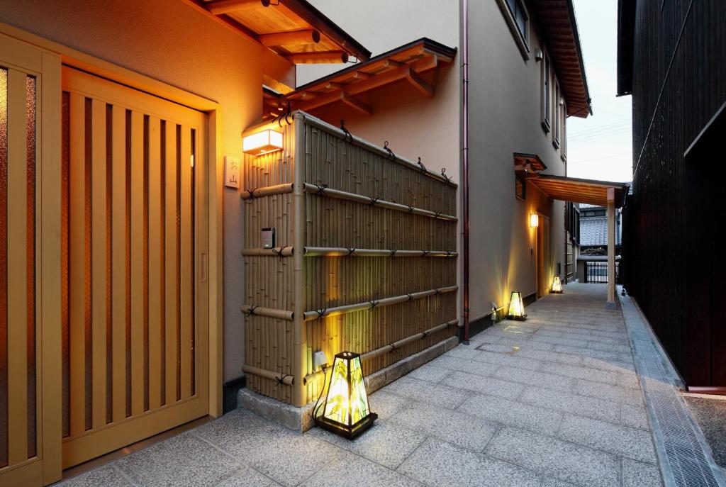 a hallway of a building with a gate and a door at Kyoyado Usagi in Kyoto