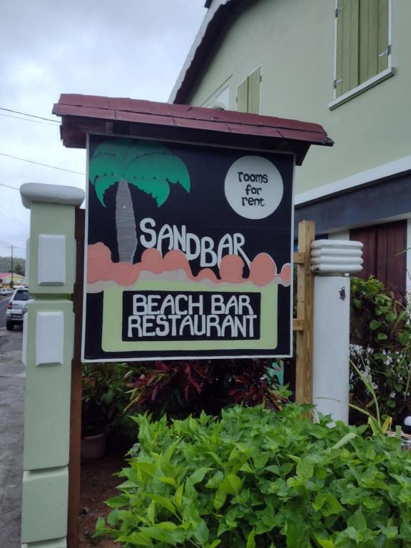 Majutusasutuses Calibishie Sandbar olev sertifikaat, autasu, silt või muu dokument