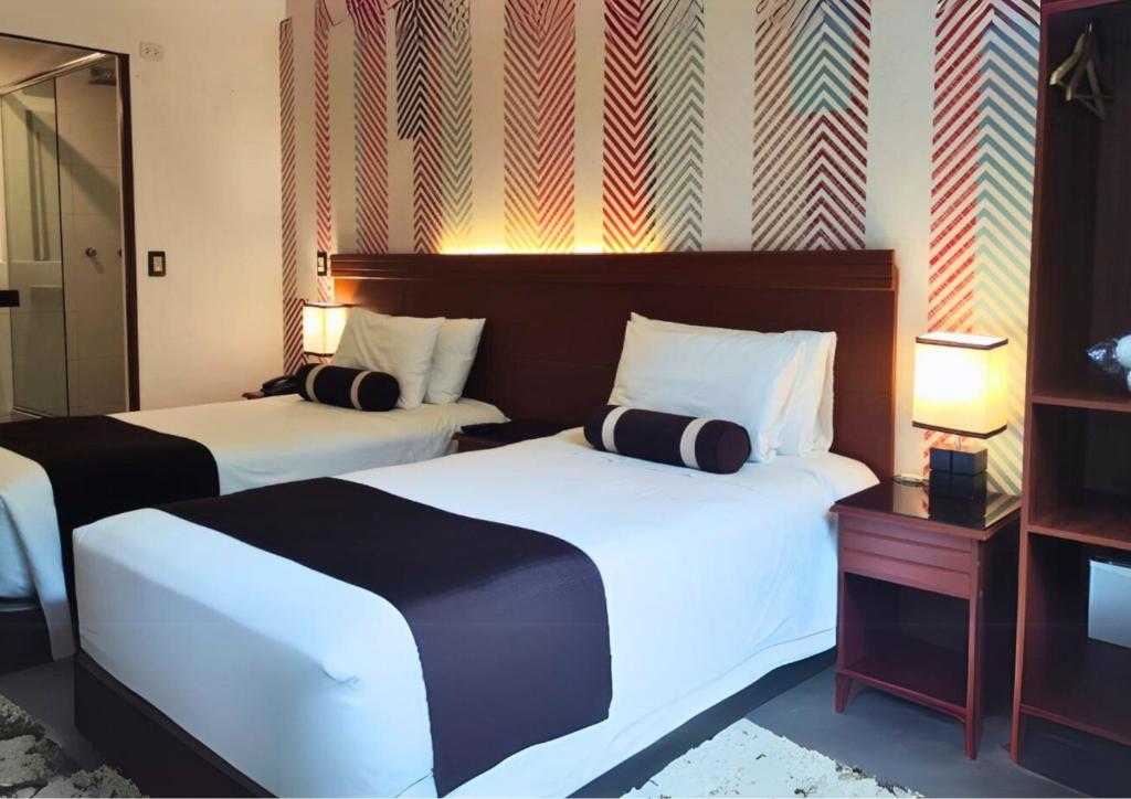 Voodi või voodid majutusasutuse Hotel Ferré Machu Picchu toas