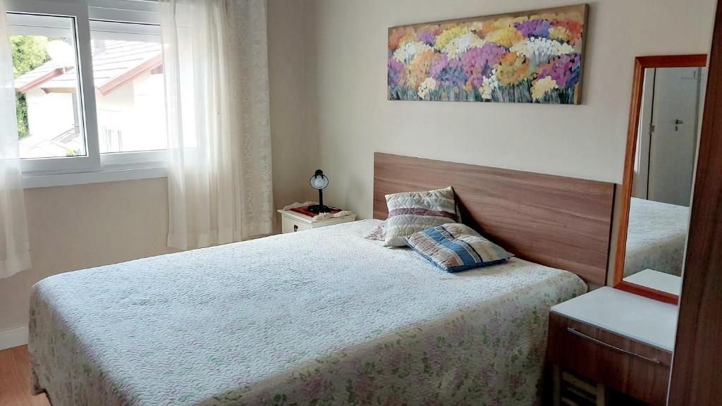 Postel nebo postele na pokoji v ubytování Suíte conforto - casa compartilhada