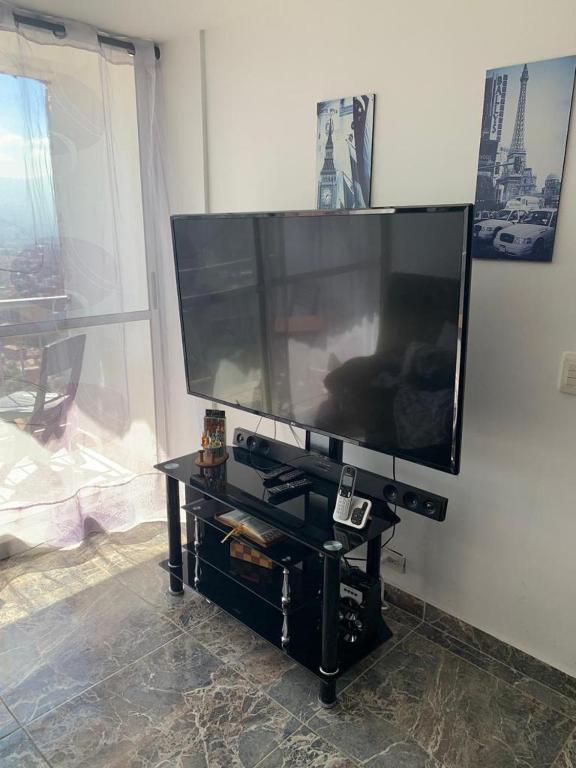 a large flat screen tv sitting on a wall at Calazania in Limoncito