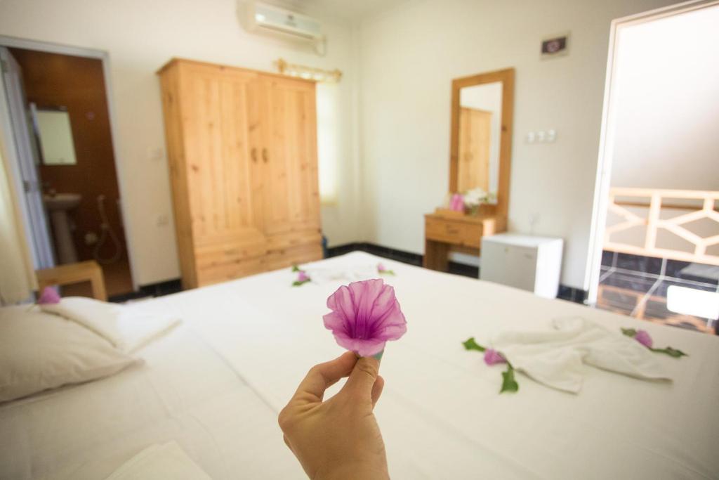 Postel nebo postele na pokoji v ubytování Faza View Inn, Maafushi