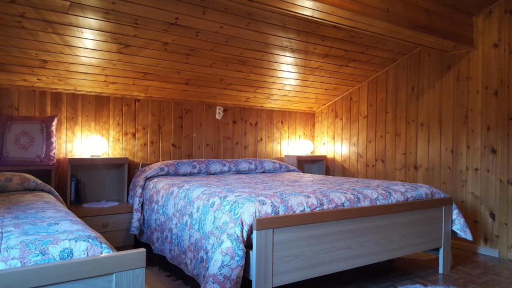 Postel nebo postele na pokoji v ubytování Cèsa Silvano