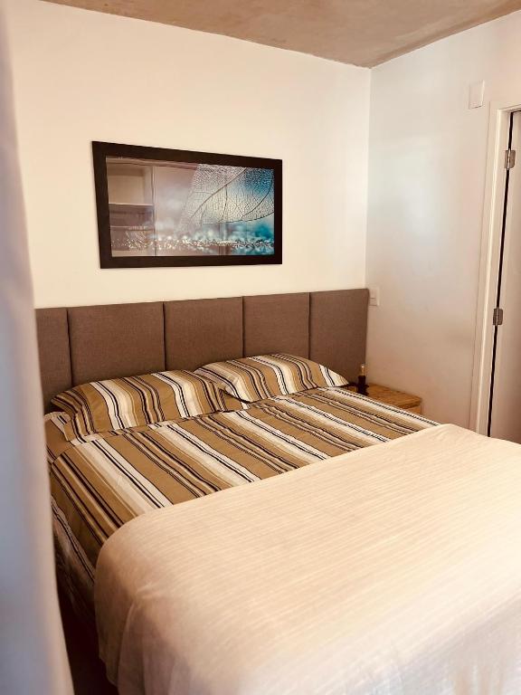 Postel nebo postele na pokoji v ubytování Studio Moderno no Centro - Check-in Digital e Wi-Fi Rápido