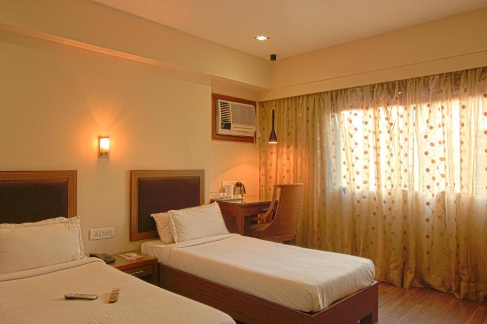 Postel nebo postele na pokoji v ubytování Hotel Amigo