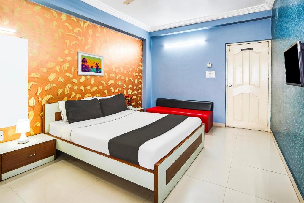 Postel nebo postele na pokoji v ubytování Super Hotel O Vibrant Residency