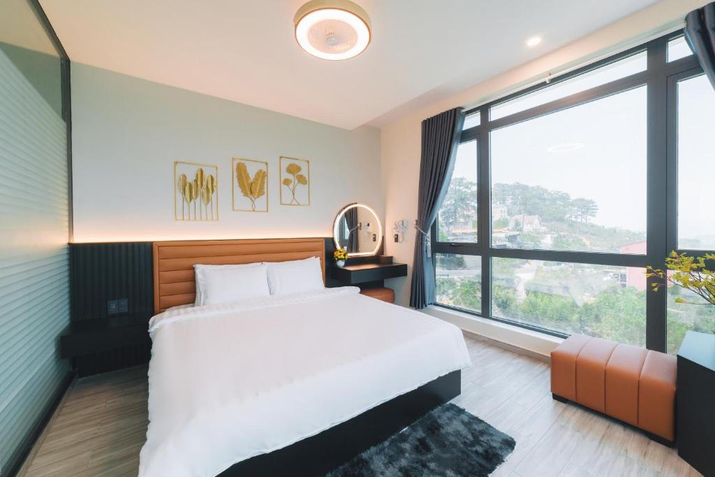 Postel nebo postele na pokoji v ubytování Greenview City Hotel